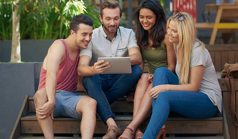 Group of people using tablet