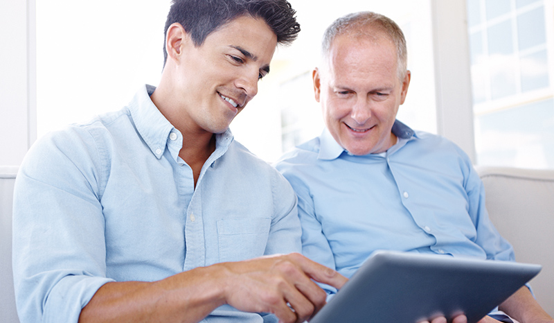 Businessmen using tablet